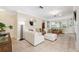 Comfortable living room featuring a modern white sofa and ample natural light at 4856 Alamo Ct # 4856, New Port Richey, FL 34655