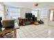 Bright and airy bonus room with tile flooring and large windows at 5128 Perennial Dr, Holiday, FL 34690
