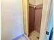 Small shower stall features purple tiling and a simple shower head at 5128 Perennial Dr, Holiday, FL 34690