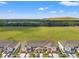 Aerial view of townhomes surrounded by green space, offering serene community living at 5383 Companion Ln, Tampa, FL 33619