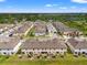 Birds eye view of community townhomes with well-maintained landscaping and neighborhood streets at 5383 Companion Ln, Tampa, FL 33619
