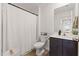 Full bathroom featuring dark vanity, shower with curtain and decor at 5383 Companion Ln, Tampa, FL 33619