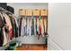 Spacious walk-in closet with organized shelving and hanging storage for clothes at 5383 Companion Ln, Tampa, FL 33619