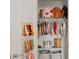 Well-organized closet with hanging clothes, shelves, and storage baskets at 5383 Companion Ln, Tampa, FL 33619
