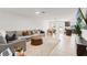 Open-concept living area seamlessly blends a cozy seating area with an adjacent kitchen at 5383 Companion Ln, Tampa, FL 33619