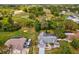 Aerial view of the property, highlighting the backyard pool and neighboring golf course, offering a serene setting at 5411 Joyner Ave, Spring Hill, FL 34608