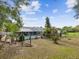 Beautiful backyard featuring a pool enclosure and a shed at 5411 Joyner Ave, Spring Hill, FL 34608