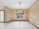 Dining area with tile flooring, window, and chandelier at 5411 Joyner Ave, Spring Hill, FL 34608