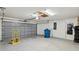Clean garage with ample space, storage, and access door at 5411 Joyner Ave, Spring Hill, FL 34608