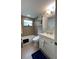 Bathroom featuring bath tub, vanity, medicine cabinet, and modern toilet at 5736 Colonial Dr, New Port Richey, FL 34653