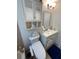Cozy bathroom boasts a white vanity, built-in storage, modern fixtures, and a toilet with bidet at 5736 Colonial Dr, New Port Richey, FL 34653