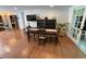 Bright dining room featuring hardwood floors, modern furnishings, and glass doors to the porch at 5736 Colonial Dr, New Port Richey, FL 34653