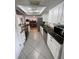 Stylish kitchen showcasing granite counters, stainless steel appliances, and contemporary cabinetry at 5736 Colonial Dr, New Port Richey, FL 34653