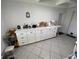 Functional kitchen featuring ample counter space, white cabinetry, and tile flooring at 5736 Colonial Dr, New Port Richey, FL 34653
