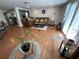 Spacious living room boasts hardwood floors, plants, and lots of natural light at 5736 Colonial Dr, New Port Richey, FL 34653