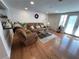 Comfortable living room with wood floors and access to outdoor patio at 5736 Colonial Dr, New Port Richey, FL 34653