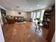 The light-filled living area has hardwood floors and direct access to the patio at 5736 Colonial Dr, New Port Richey, FL 34653