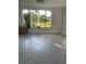 Bright sun room with pond view features durable tile floors and lots of natural light at 5736 Colonial Dr, New Port Richey, FL 34653