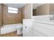 Updated bathroom featuring a tub and shower, modern vanity, and neutral finishes at 6206 11Th Ave, New Port Richey, FL 34653