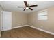 Cozy bedroom with window and ceiling fan at 6206 11Th Ave, New Port Richey, FL 34653