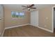 Inviting bedroom with hardwood floors and a ceiling fan at 6206 11Th Ave, New Port Richey, FL 34653