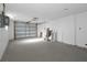 Spacious garage with roll up door and ample room for parking and storage at 6206 11Th Ave, New Port Richey, FL 34653