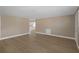 Spacious living room featuring wood floors and open access to the kitchen at 6206 11Th Ave, New Port Richey, FL 34653
