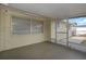 Enclosed patio providing a cozy space with screen door and windows at 6206 11Th Ave, New Port Richey, FL 34653
