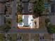 Overhead aerial view of a property with a house, yard, and surrounding neighborhood at 6431 Gainsboro Dr, Port Richey, FL 34668