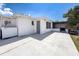 A backyard featuring a concrete patio, screened area, and an outdoor refrigerator at 6431 Gainsboro Dr, Port Richey, FL 34668