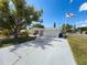 Charming single-story home boasts a brick facade, spacious driveway, and a well-manicured lawn at 6431 Gainsboro Dr, Port Richey, FL 34668