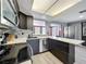 Bright kitchen with stainless steel appliances, quartz countertops, and a modern design at 6431 Gainsboro Dr, Port Richey, FL 34668
