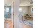 Stylishly designed bathroom with a tiled shower, and a view of a home office at 6432 Boatyard Dr, Hudson, FL 34667