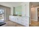 Kitchen featuring white cabinetry, tiled backsplash, and a peek at the canal view at 6432 Boatyard Dr, Hudson, FL 34667