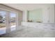 Kitchen featuring white cabinetry, tiled backsplash, and a peek at the canal view at 6432 Boatyard Dr, Hudson, FL 34667