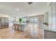 Bright, spacious kitchen with an island, stainless steel refrigerator, and double doors to the backyard at 6432 Boatyard Dr, Hudson, FL 34667