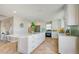 Large kitchen with a marble countertop island, stainless steel appliances, and herringbone floors at 6432 Boatyard Dr, Hudson, FL 34667