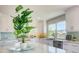 Spacious kitchen with white cabinetry, stainless steel appliances, and a lovely backyard view at 6432 Boatyard Dr, Hudson, FL 34667