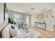 Cozy living room boasting herringbone floors, a white couch, and bright lighting at 6432 Boatyard Dr, Hudson, FL 34667