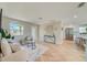 Open-concept living room and kitchen with bar stool seating at the island at 6432 Boatyard Dr, Hudson, FL 34667