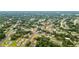 Expansive aerial view of a neighborhood with lush greenery and well-maintained homes in a beautiful community at 7365 Pinehurst Dr, Spring Hill, FL 34606