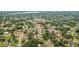 Neighborhood aerial view showcasing property location in a community, close to amenities with lush surroundings at 7365 Pinehurst Dr, Spring Hill, FL 34606