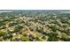 Neighborhood aerial view highlighting property in a residential community with tree-lined streets and nearby amenities at 7365 Pinehurst Dr, Spring Hill, FL 34606