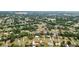 An aerial view showing the property surrounded by lush greenery in a beautiful neighborhood at 7365 Pinehurst Dr, Spring Hill, FL 34606