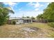 Large fenced backyard with a back patio and space for activities at 7365 Pinehurst Dr, Spring Hill, FL 34606