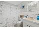 Cozy bathroom featuring a Paris-themed shower curtain and tiled floor at 7365 Pinehurst Dr, Spring Hill, FL 34606