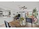 Open living space features tile floors, neutral paint, and dining area with bright window at 7365 Pinehurst Dr, Spring Hill, FL 34606