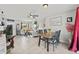 Open concept living and dining area with neutral tones and lots of natural light at 7365 Pinehurst Dr, Spring Hill, FL 34606