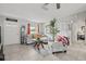 Cozy living room showcasing tile flooring, ample natural light, and a comfortable seating area at 7365 Pinehurst Dr, Spring Hill, FL 34606
