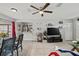 Inviting living room featuring an open layout, tile floors, and modern decor at 7365 Pinehurst Dr, Spring Hill, FL 34606